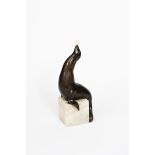 λ Marcel-Andre Bouraine (1886-1948) Sealion with a Ball, patinated bronze with ivory ball, on veined