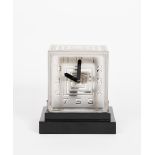 A French Art Deco frosted glass Bulle clock by P M Favre, square section, cast in low relief with