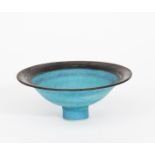 ‡Emmanuel Cooper OBE (1938-2012) a porcelain footed bowl, covered in a pitted blue glaze, the