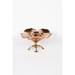 A WAS Benson copper and brass rose bowl, model no.776, flaring foliate form with pierced rose, on