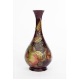 A Moorcroft Collector's Club solifleur vase, dated 1996, painted with wild fruit in colours on a