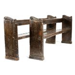 A PAIR OF JAMES I OAK CHURCH PEWS / BENCHES EARLY 17TH CENTURY each carved with leaf scroll