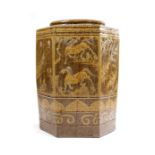 A SOUTH EAST ASIAN POTTERY STORAGE JAR of hexagonal form, decorated with panels of horses, birds,