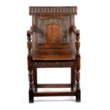 AN OAK AND MARQUETRY PANELLED BACK ARMCHAIR EARLY 17TH CENTURY with a raised lozenge top rail, above