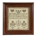 A SMALL REGENCY NEEDLEWORK SAMPLER BY ANN BUNCHMARCH worked with tulips and strawberries, above a