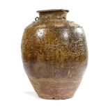 A SOUTH EAST ASIAN POTTERY STORAGE JAR PROBABLY 17TH / 18TH CENTURY with a flared neck applied