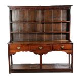 A GEORGE III WELSH OAK POTBOARD DRESSER SOUTH WALES, LATE 18TH CENTURY the raised plate rack with