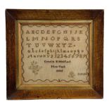 AN AMERICAN NEEDLEWORK SAMPLER BY CORNELIA B MITFORD worked in cross stitch on a linen ground with