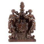 A 17TH CENTURY GERMAN OAK PEW END FINIAL DATED '1624' carved with a cone finial above a pair of