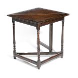 AN OAK CORNER TABLE EARLY 18TH CENTURY the single drop-leaf top on gate support, with slender