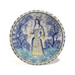 A LONDON DELFTWARE POTTERY QUEEN ANNE CHARGER ATTRIBUTED TO NORFOLK HOUSE, C.1702-14 painted in