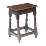 A CHARLES I OAK JOINT STOOL C.1640 the rectangular top with a moulded edge, the frieze inlaid with a