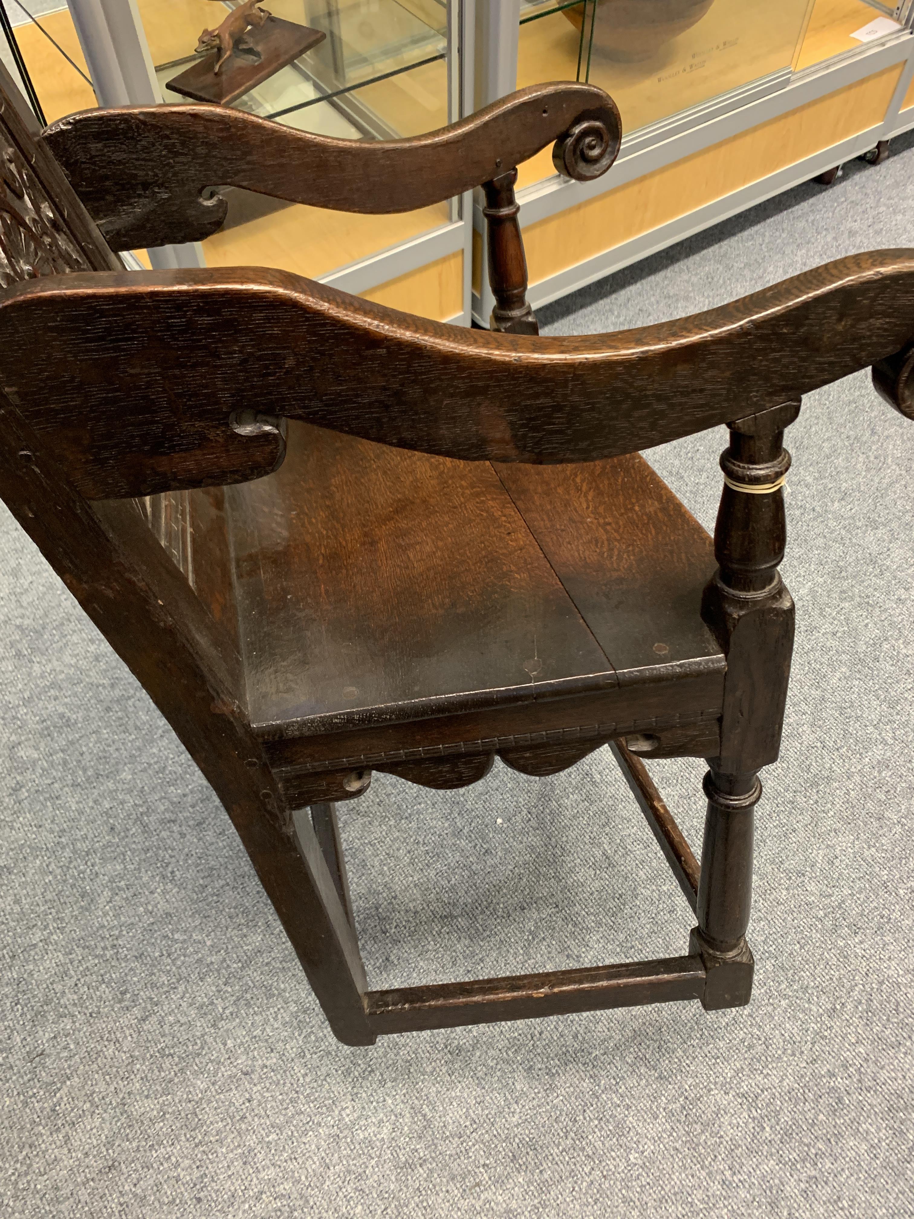 A CHARLES I OAK PANELLED BACK ARMCHAIR DATED '1638' the scroll carved crest centred with a fleur- - Image 10 of 13