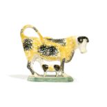 A PRATT WARE POTTERY COW CREAMER LATE 18TH / EARLY 19TH CENTURY accompanied by her calf, with