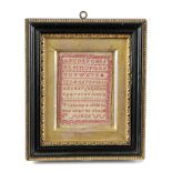 A MINIATURE GEORGE IV NEEDLEWORK SAMPLER DATED '1826' worked in red silk with cross stitch on a