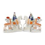 TWO PAIRS OF STAFFORDSHIRE POTTERY FIGURES 19TH CENTURY comprising: a pair of spill vases,