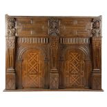 A LARGE OAK PANEL / OVERMANTEL EARLY 17TH CENTURY AND LATER with a pair of geometric panels, flanked