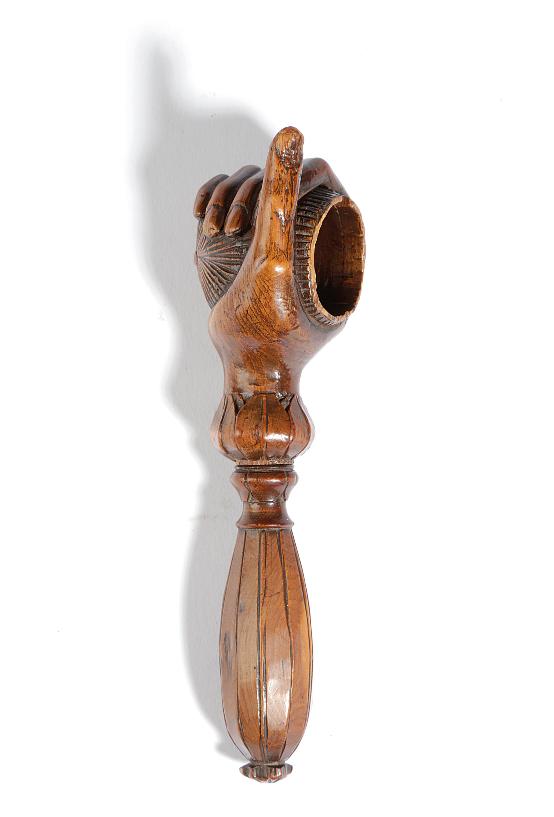A SWISS TREEN NOVELTY NUTCRACKER 19TH CENTURY in the form of a hand holding a walnut, with a screw