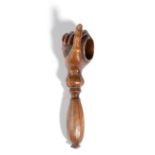 A SWISS TREEN NOVELTY NUTCRACKER 19TH CENTURY in the form of a hand holding a walnut, with a screw