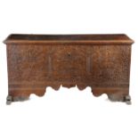 A LARGE OAK CHEST 17TH CENTURY the hinged lid revealing an interior with a lidded till, the front