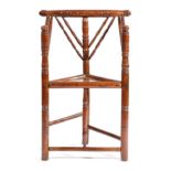 A GEORGE III YEW APPRENTICE TURNER'S CHAIR C.1790-1800 with a spindle back above a triangular