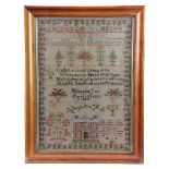 A WILLIAM IV NEEDLEWORK SAMPLER BY MARGARET PEEL worked with coloured wool on a linen ground, with a