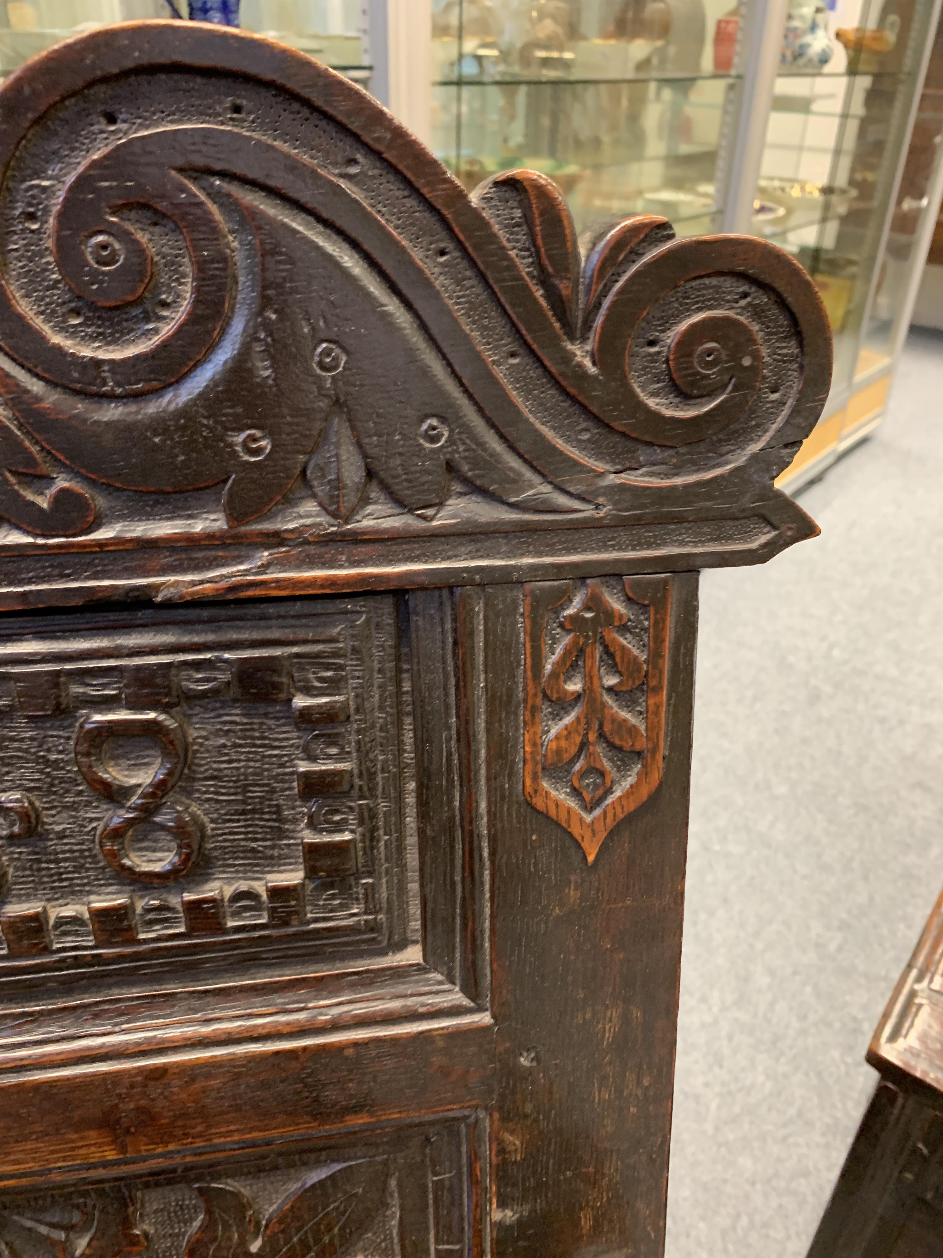 A CHARLES I OAK PANELLED BACK ARMCHAIR DATED '1638' the scroll carved crest centred with a fleur- - Image 4 of 13