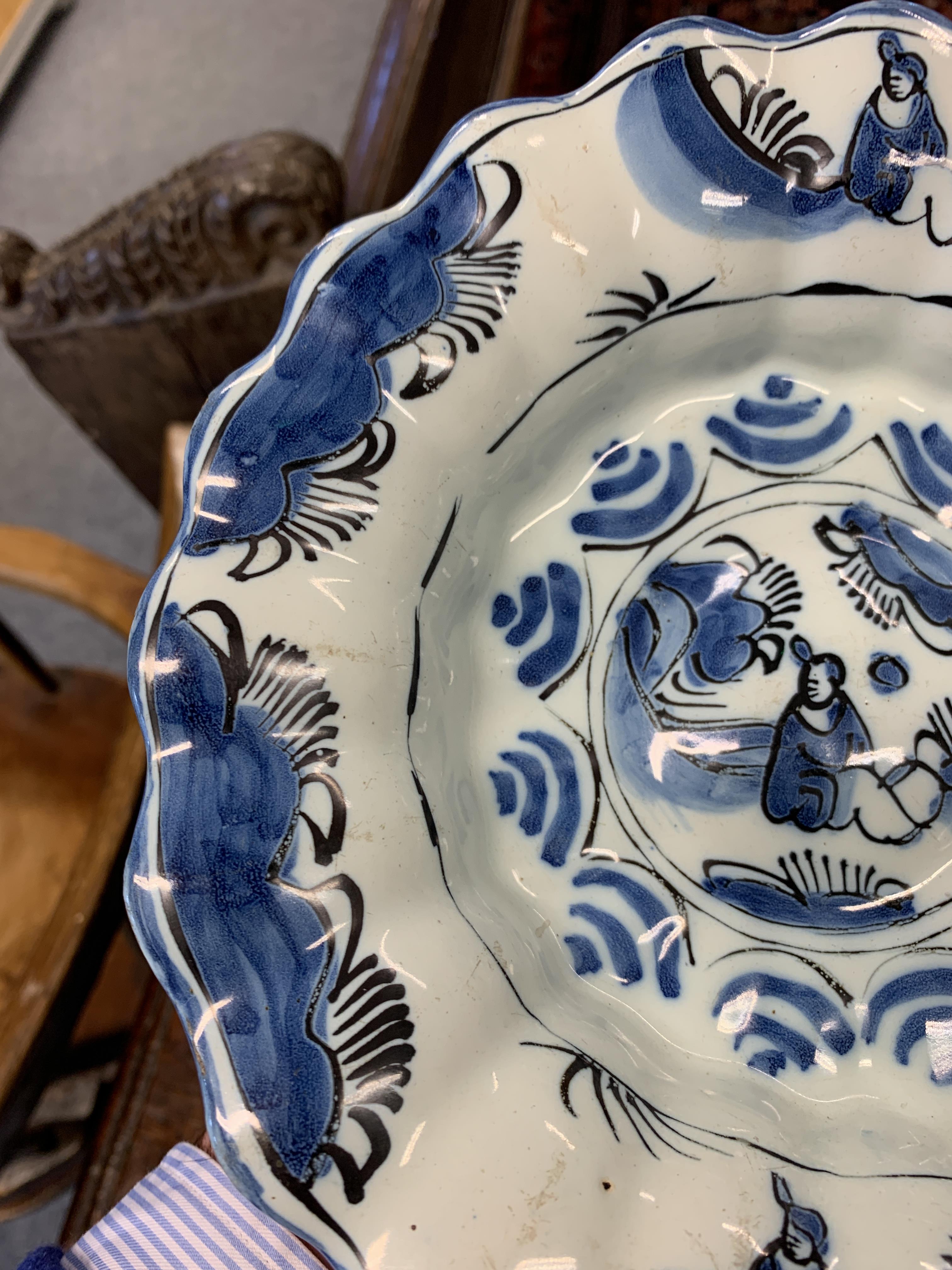 TWO DELFT POTTERY LOBED DISHES EARLY 18TH CENTURY each painted in blue and black with a seated - Image 5 of 16