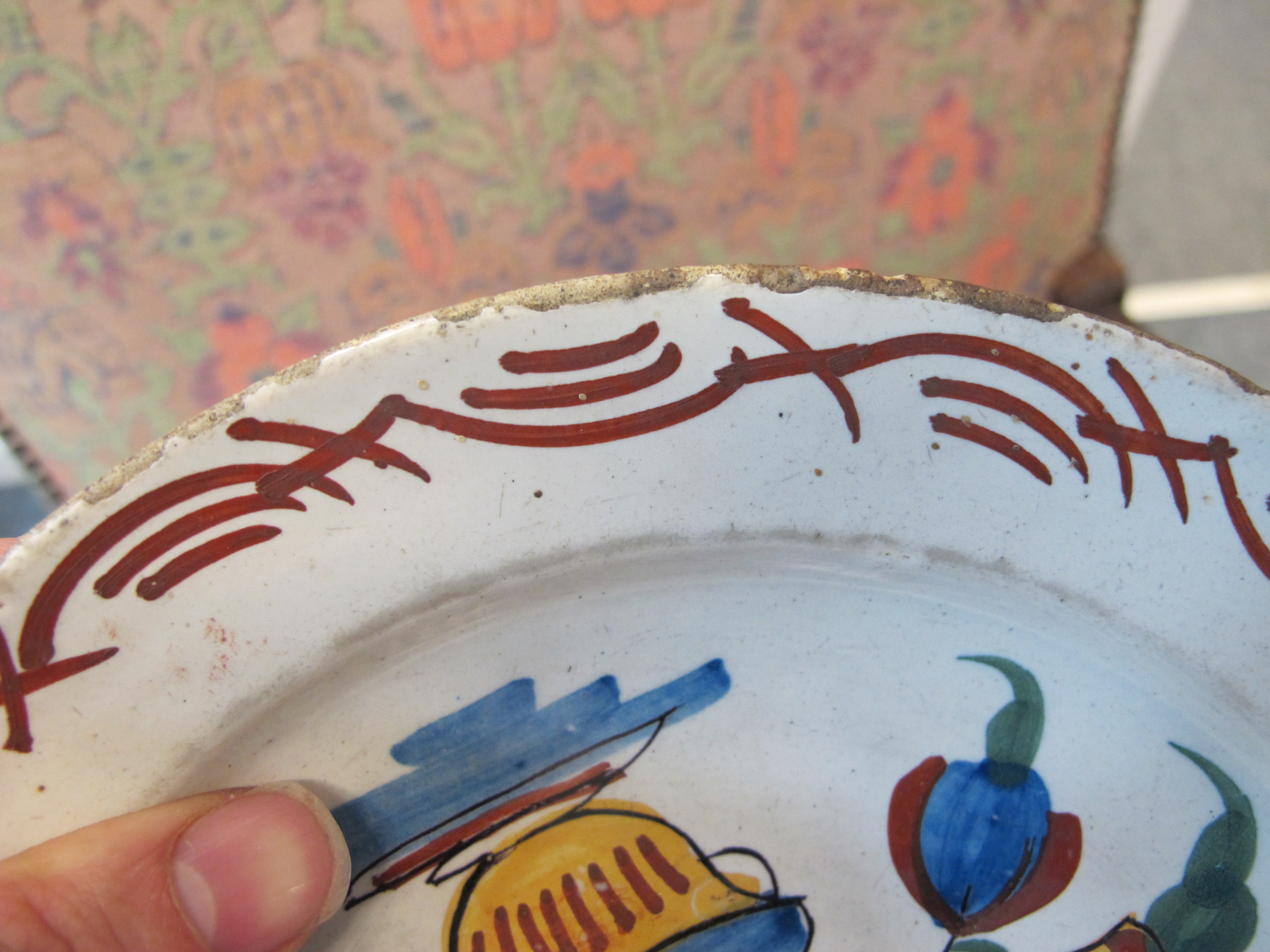 THREE DELFTWARE POTTERY PLATES 18TH CENTURY polychrome decorated with a bird on a fence, and urns of - Image 6 of 24
