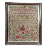 A LARGE VICTORIAN NEEDLEWORK SCHOOL SAMPLER BY MARGARET REILLY worked with polychrome wools on a