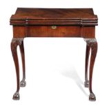 A GEORGE II MAHOGANY COMBINED TEA AND GAMES TABLE C.1735-40 the triple hinged top with protruding