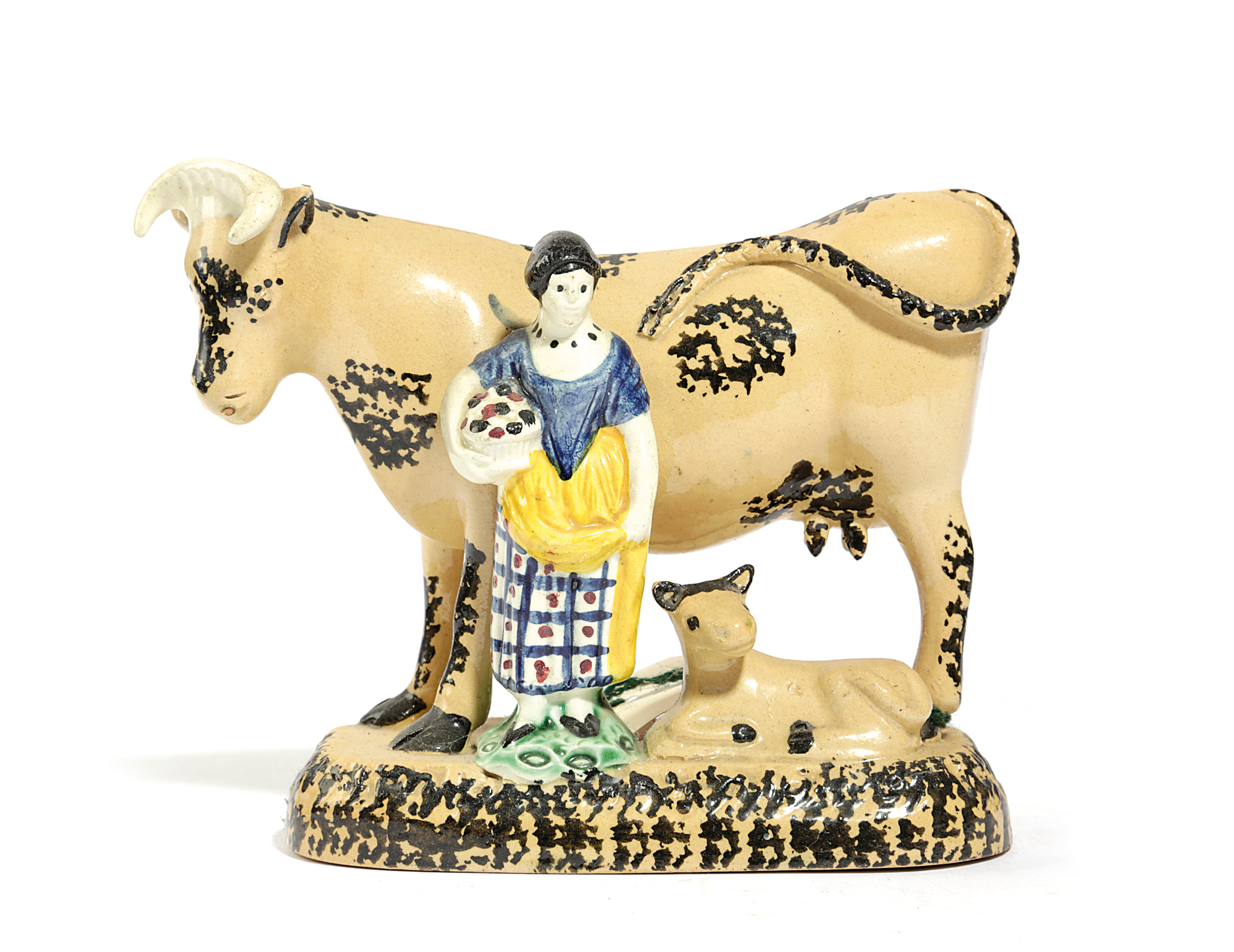 A YORKSHIRE PRATT TYPE POTTERY COW GROUP C.1810 the buff coloured bovine with sponge decoration