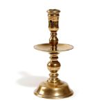 A DUTCH BRASS HEEMSKERK CANDLESTICK SECOND HALF 17TH CENTURY with a pierced socket and a turned