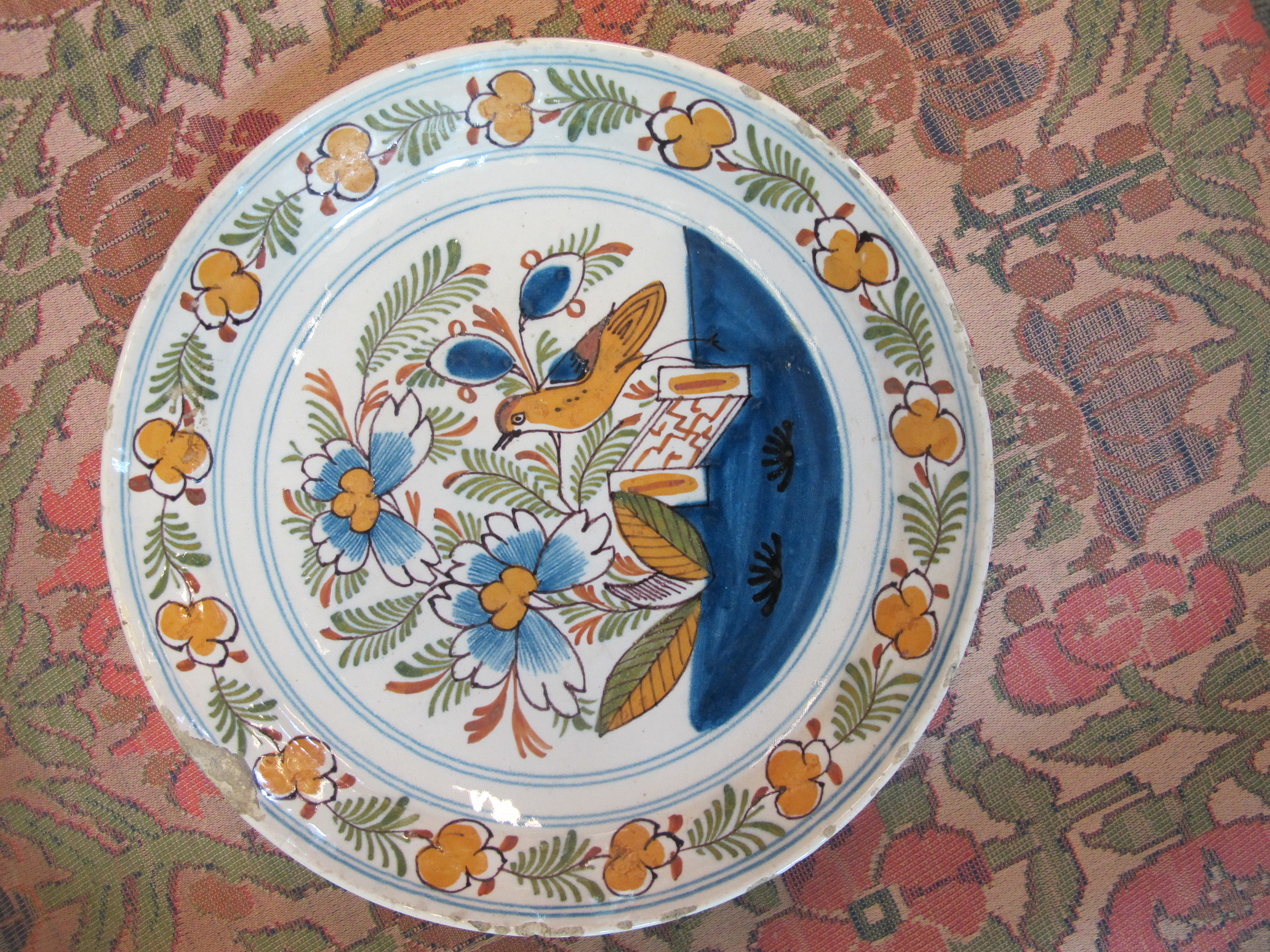 THREE DELFTWARE POTTERY PLATES 18TH CENTURY polychrome decorated with a bird on a fence, and urns of - Image 9 of 24