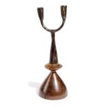 AN IRON TWIN CANDLEHOLDER 18TH CENTURY mounted on a treen base 34cm high Provenance Upper