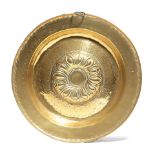 A GERMAN BRASS ALMS DISH NUREMBERG, 17TH CENTURY the centre with a repousse whorl boss within a band