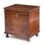 A GEORGE I OAK CLOSE STOOL EARLY 18TH CENTURY with a hinged lid revealing a vacant interior, the