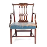 A GEORGE III MAHOGANY OPEN ARMCHAIR C.1760 AND LATER the leaf carved serpentine top rail above a