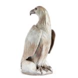 A LARGE STONEWARE POTTERY MODEL OF AN EAGLE the underside marked '82' 53cm high Provenance Upper