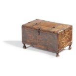 A SMALL WOODEN CHEST IN MEDIEVAL STYLE incised with rondels and with iron mounts, with a part hinged