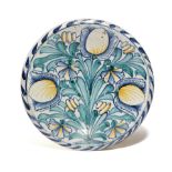 A DELFTWARE POTTERY TULIP CHARGER LONDON, C.1670-85 boldly painted in green, blue and ochre with a