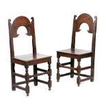 A PAIR OF CHARLES II OAK CHAIRS ATTRIBUTED TO DERBYSHIRE, C.1680 each with an arched back above a