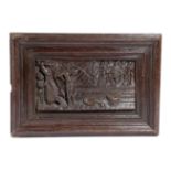 A DUTCH OAK PANEL 17TH CENTURY relief carved with two men butchering a cow, with a basket of