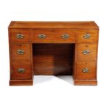 A GEORGE III MAHOGANY NAVAL OFFICER'S DRESSING TABLE EARLY 19TH CENTURY the hinged top revealing a
