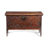 A SMALL 17TH CENTURY OAK COFFER PROBABLY WEST COUNTRY of five plank construction, the hinged lid