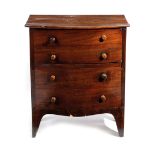 A SMALL MAHOGANY BOWFRONT COMMODE CHEST EARLY 19TH CENTURY the hinged lid revealing an interior with