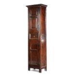 A GEORGE II OAK NARROW CUPBOARD C.1740 with two panelled cupboard doors, the upper one enclosing two