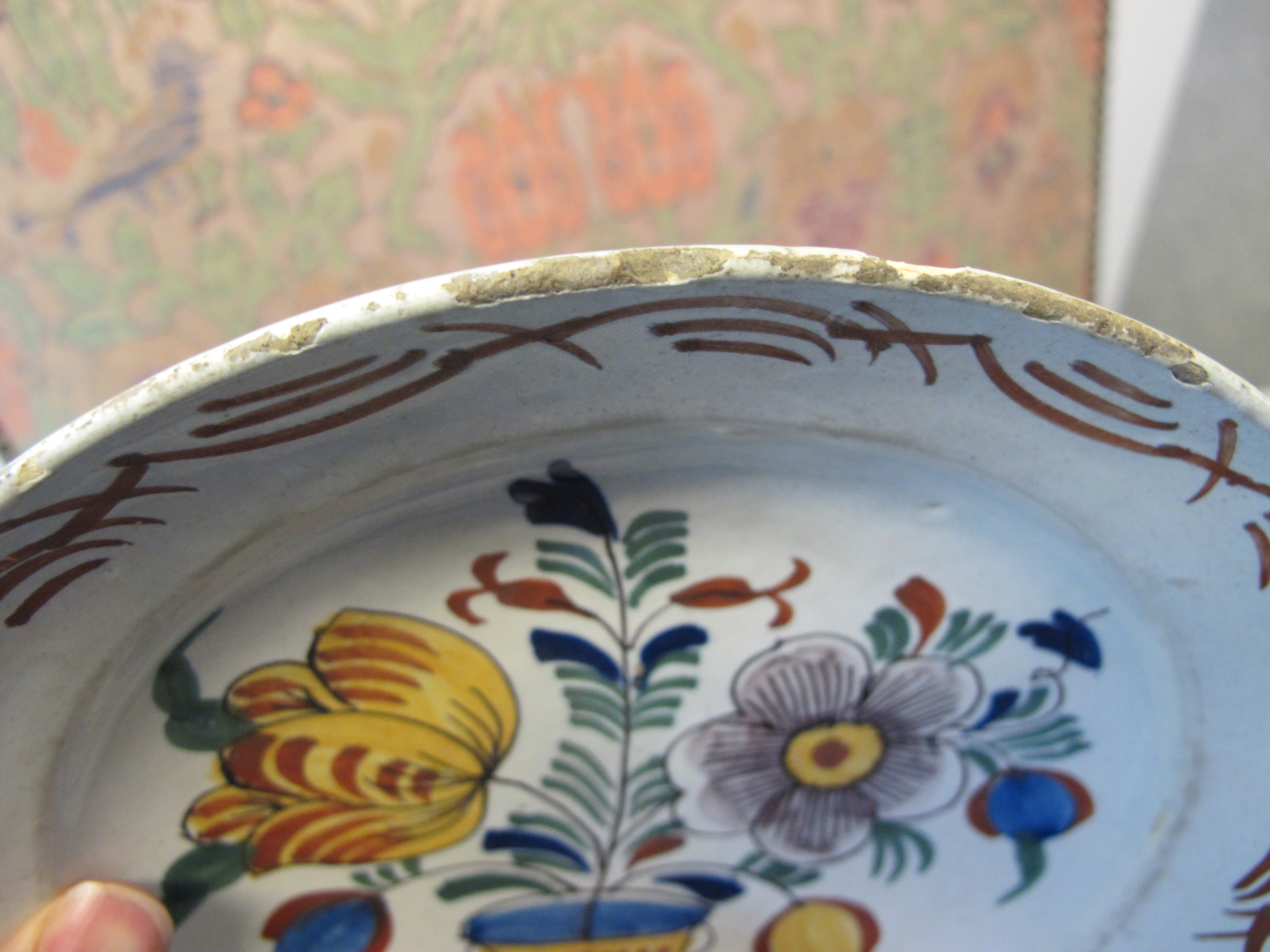 THREE DELFTWARE POTTERY PLATES 18TH CENTURY polychrome decorated with a bird on a fence, and urns of - Image 3 of 24