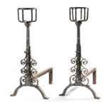 A PAIR OF WROUGHT IRON ANDIRONS IN 17TH CENTURY STYLE each with a bottle holder top and with