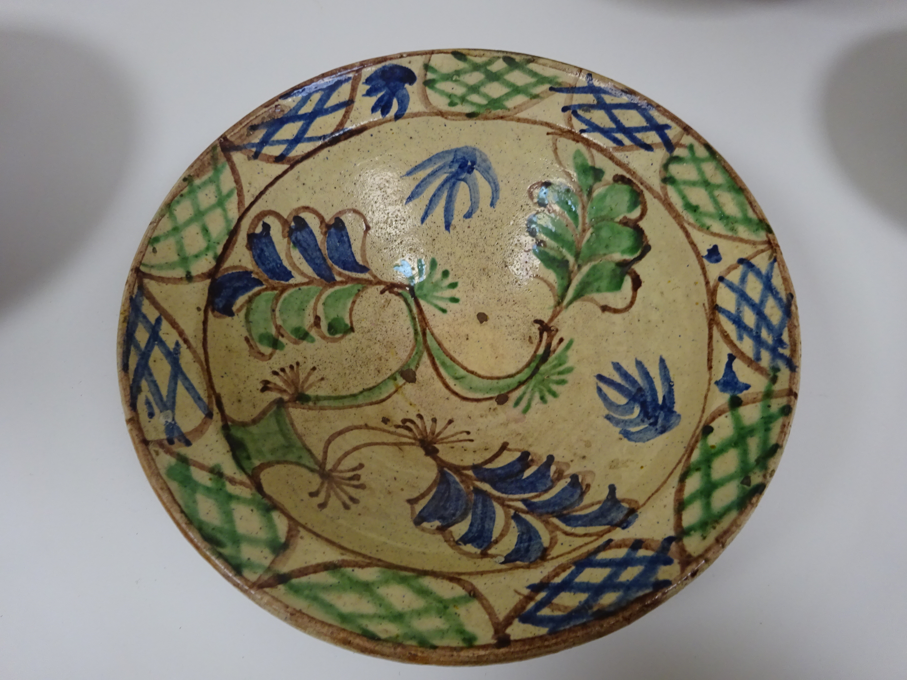 THREE SPANISH TIN-GLAZED POTTERY BOWLS 19TH / 20TH CENTURY each painted with flowers and a smaller - Image 12 of 13